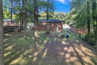This charming 3-bedroom, 2-bath, 4-sided brick ranch in on Browns Mill Golf Course in Georgia - for sale on GolfHomes.com, golf home, golf lot