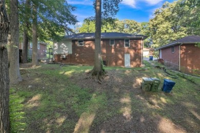 This charming 3-bedroom, 2-bath, 4-sided brick ranch in on Browns Mill Golf Course in Georgia - for sale on GolfHomes.com, golf home, golf lot