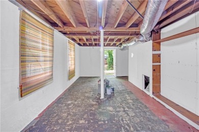 This charming 3-bedroom, 2-bath, 4-sided brick ranch in on Browns Mill Golf Course in Georgia - for sale on GolfHomes.com, golf home, golf lot