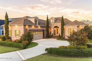 Some homes capture water views. This one lives in them. Custom on Ocean Ridge Plantation in North Carolina - for sale on GolfHomes.com, golf home, golf lot