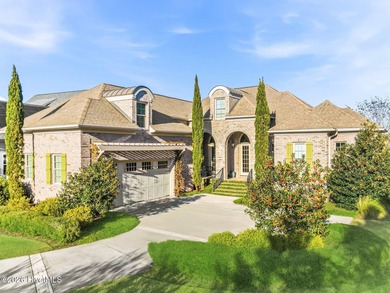 Some homes capture water views. This one lives in them. Custom on Ocean Ridge Plantation in North Carolina - for sale on GolfHomes.com, golf home, golf lot