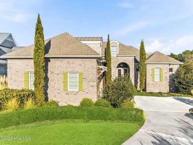 Some homes capture water views. This one lives in them. Custom on Ocean Ridge Plantation in North Carolina - for sale on GolfHomes.com, golf home, golf lot