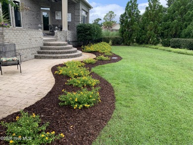 Some homes capture water views. This one lives in them. Custom on Ocean Ridge Plantation in North Carolina - for sale on GolfHomes.com, golf home, golf lot