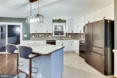 Bright and open one-level living in the fabulous gated community on Aquia Harbour Golf and Country Club in Virginia - for sale on GolfHomes.com, golf home, golf lot