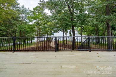 Welcome to this truly spectacular lakefront dream home in the on Old North State Club at Uwharrie Point Golf community in North Carolina - for sale on GolfHomes.com, golf home, golf lot