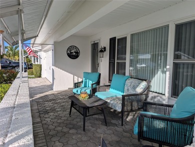 Under contract-accepting backup offers. Pride of ownership is on Mainlands Golf Club in Florida - for sale on GolfHomes.com, golf home, golf lot