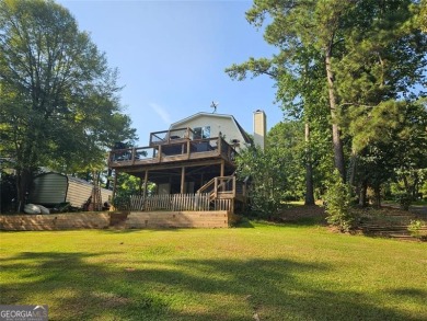 Check out this awesome lakefront property on Jackson Lake in the on Turtle Cove Golf Course in Georgia - for sale on GolfHomes.com, golf home, golf lot