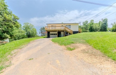 Updated water view home with a full basement, located less than on Piney Point Golf Club in North Carolina - for sale on GolfHomes.com, golf home, golf lot