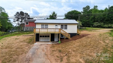 Updated water view home with a full basement, located less than on Piney Point Golf Club in North Carolina - for sale on GolfHomes.com, golf home, golf lot