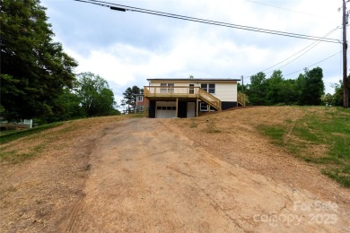 Updated water view home with a full basement, located less than on Piney Point Golf Club in North Carolina - for sale on GolfHomes.com, golf home, golf lot
