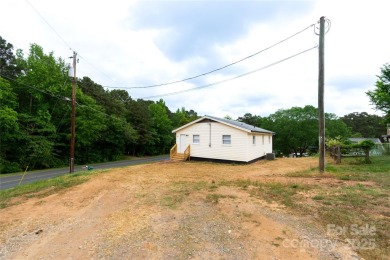 Updated water view home with a full basement, located less than on Piney Point Golf Club in North Carolina - for sale on GolfHomes.com, golf home, golf lot