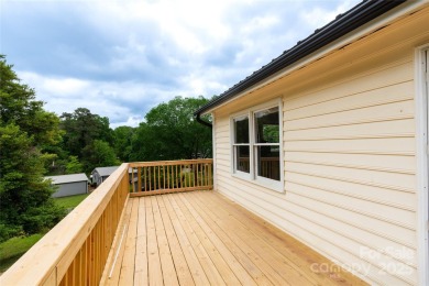Updated water view home with a full basement, located less than on Piney Point Golf Club in North Carolina - for sale on GolfHomes.com, golf home, golf lot