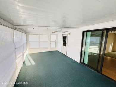 Dont miss this 2-bedroom, 2-bath mobile home featuring a on Barefoot Bay Golf Course in Florida - for sale on GolfHomes.com, golf home, golf lot