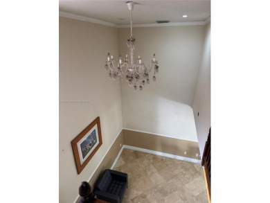 Nestled in a prestigious golf community, this beautifully on  in Florida - for sale on GolfHomes.com, golf home, golf lot