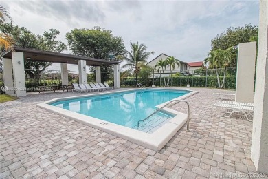 Nestled in a prestigious golf community, this beautifully on  in Florida - for sale on GolfHomes.com, golf home, golf lot