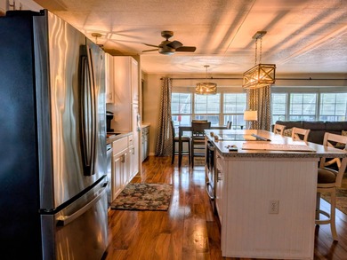 This immaculate home exudes charm and elegance, perfectly on Grasslands Golf and Country Club in Florida - for sale on GolfHomes.com, golf home, golf lot