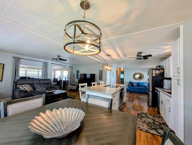 This immaculate home exudes charm and elegance, perfectly on Grasslands Golf and Country Club in Florida - for sale on GolfHomes.com, golf home, golf lot