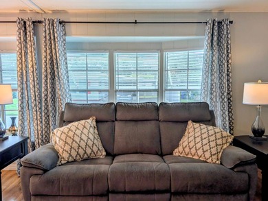 This immaculate home exudes charm and elegance, perfectly on Grasslands Golf and Country Club in Florida - for sale on GolfHomes.com, golf home, golf lot