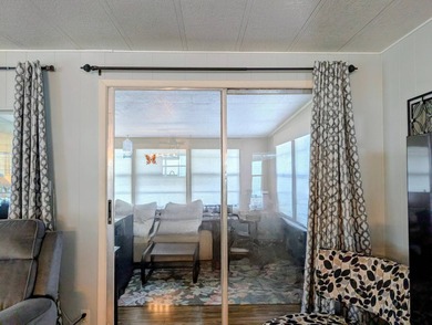 This immaculate home exudes charm and elegance, perfectly on Grasslands Golf and Country Club in Florida - for sale on GolfHomes.com, golf home, golf lot