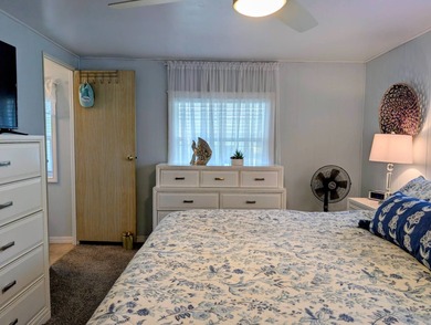 This immaculate home exudes charm and elegance, perfectly on Grasslands Golf and Country Club in Florida - for sale on GolfHomes.com, golf home, golf lot