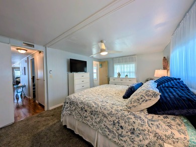 This immaculate home exudes charm and elegance, perfectly on Grasslands Golf and Country Club in Florida - for sale on GolfHomes.com, golf home, golf lot