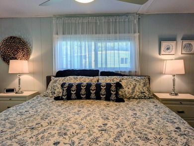 This immaculate home exudes charm and elegance, perfectly on Grasslands Golf and Country Club in Florida - for sale on GolfHomes.com, golf home, golf lot