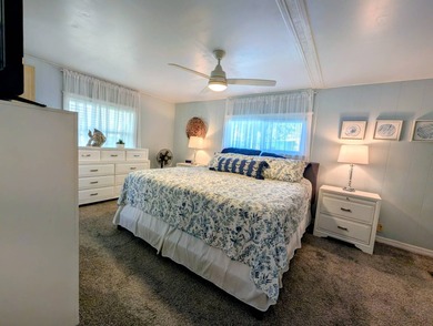 This immaculate home exudes charm and elegance, perfectly on Grasslands Golf and Country Club in Florida - for sale on GolfHomes.com, golf home, golf lot