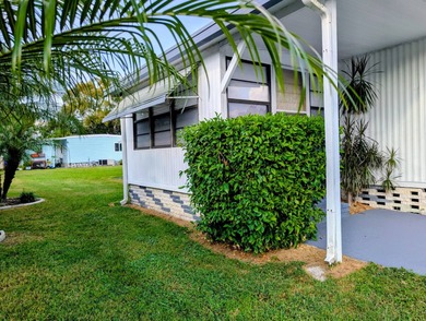 This immaculate home exudes charm and elegance, perfectly on Grasslands Golf and Country Club in Florida - for sale on GolfHomes.com, golf home, golf lot