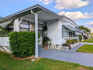 This immaculate home exudes charm and elegance, perfectly on Grasslands Golf and Country Club in Florida - for sale on GolfHomes.com, golf home, golf lot