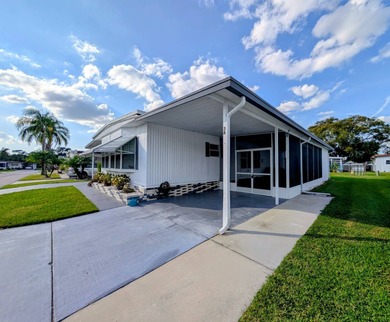 This immaculate home exudes charm and elegance, perfectly on Grasslands Golf and Country Club in Florida - for sale on GolfHomes.com, golf home, golf lot