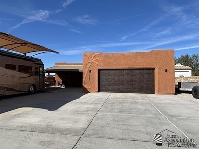 If desert living, open space, and room for your RVs and toys are on Las Barrancas Golf Course in Arizona - for sale on GolfHomes.com, golf home, golf lot