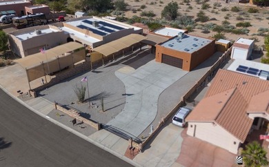 If desert living, open space, and room for your RVs and toys are on Las Barrancas Golf Course in Arizona - for sale on GolfHomes.com, golf home, golf lot