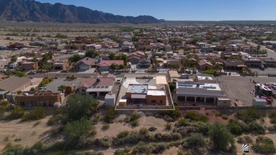 If desert living, open space, and room for your RVs and toys are on Las Barrancas Golf Course in Arizona - for sale on GolfHomes.com, golf home, golf lot