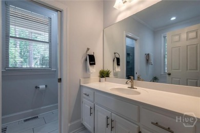 Discover the perfect blend of Southern charm and modern comfort on Great Waters Course At Reynolds Plantation in Georgia - for sale on GolfHomes.com, golf home, golf lot