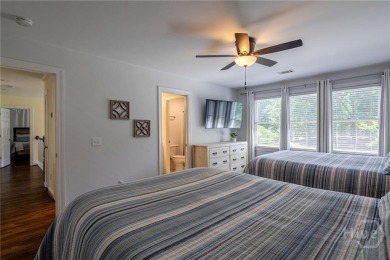 Discover the perfect blend of Southern charm and modern comfort on Great Waters Course At Reynolds Plantation in Georgia - for sale on GolfHomes.com, golf home, golf lot