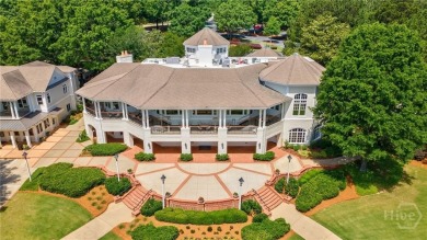 Discover the perfect blend of Southern charm and modern comfort on Great Waters Course At Reynolds Plantation in Georgia - for sale on GolfHomes.com, golf home, golf lot