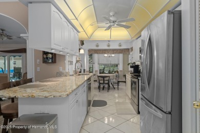 Welcome to this totally updated POOL HOME. SOLAR HEATED POOL on Timber Pines Golf Course in Florida - for sale on GolfHomes.com, golf home, golf lot