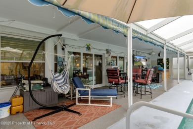 Welcome to this totally updated POOL HOME. SOLAR HEATED POOL on Timber Pines Golf Course in Florida - for sale on GolfHomes.com, golf home, golf lot