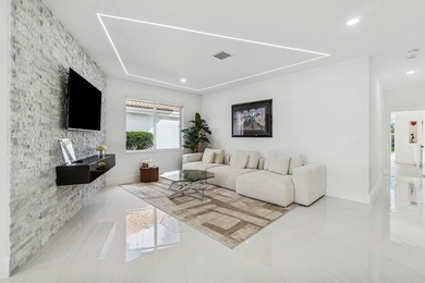 A striking, newly renovated two-story residence showcasing on  in Florida - for sale on GolfHomes.com, golf home, golf lot