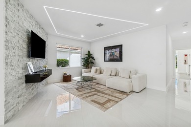 A striking, newly renovated two-story residence showcasing on Polo Club of Boca Raton in Florida - for sale on GolfHomes.com, golf home, golf lot