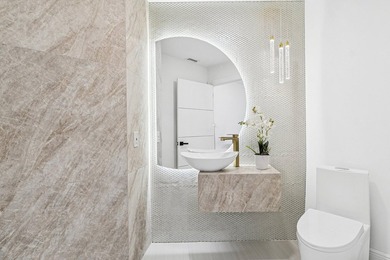 A striking, newly renovated two-story residence showcasing on  in Florida - for sale on GolfHomes.com, golf home, golf lot