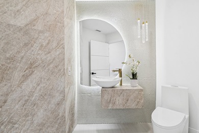 A striking, newly renovated two-story residence showcasing on Polo Club of Boca Raton in Florida - for sale on GolfHomes.com, golf home, golf lot