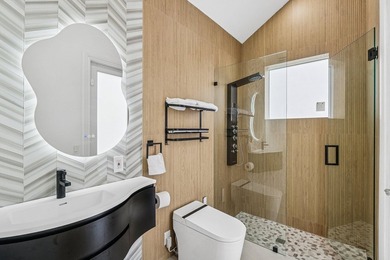 A striking, newly renovated two-story residence showcasing on  in Florida - for sale on GolfHomes.com, golf home, golf lot