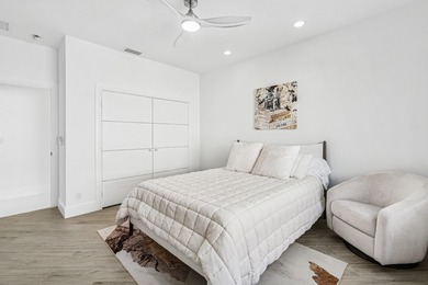 A striking, newly renovated two-story residence showcasing on Polo Club of Boca Raton in Florida - for sale on GolfHomes.com, golf home, golf lot