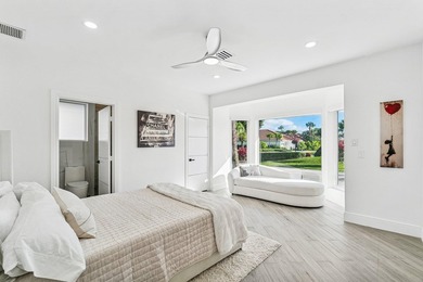 A striking, newly renovated two-story residence showcasing on  in Florida - for sale on GolfHomes.com, golf home, golf lot