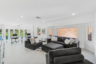 A striking, newly renovated two-story residence showcasing on  in Florida - for sale on GolfHomes.com, golf home, golf lot