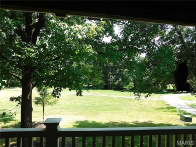 Enjoy golf course living in this spacious 2-story end-unit condo on Lake Forest Golf and Country Club in Missouri - for sale on GolfHomes.com, golf home, golf lot