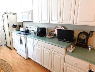 Enjoy golf course living in this spacious 2-story end-unit condo on Lake Forest Golf and Country Club in Missouri - for sale on GolfHomes.com, golf home, golf lot