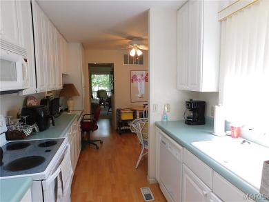 Enjoy golf course living in this spacious 2-story end-unit condo on Lake Forest Golf and Country Club in Missouri - for sale on GolfHomes.com, golf home, golf lot