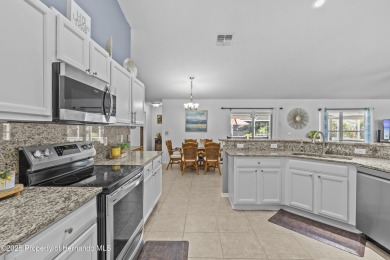 Step into refined Florida living with this beautifully upgraded on Spring Hill Golf Course in Florida - for sale on GolfHomes.com, golf home, golf lot